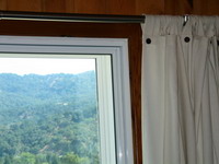 Home office, corner of sliding glass door, after installing Soundproof Windows