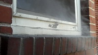 Demonstration showing fog escaping through shut window; new interior energy efficient window is open on the inside.
