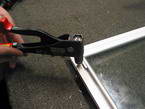 A tool being used on a window frame