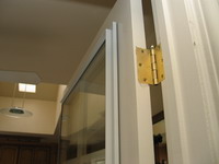 Close-Up of Soundproofing Glass Panel Mounted on an Interior French Door